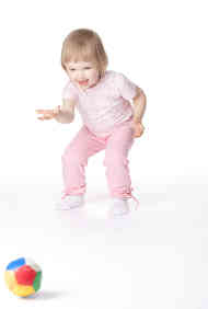 Image of young girl playing with a ball