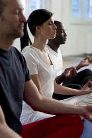 Image of people sitting and meditating